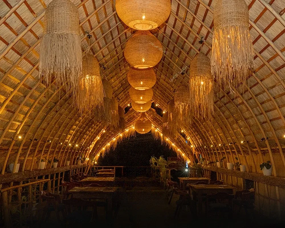 The bamboo-vaulted dining hall at Chingu Restaurant in Ella, lit by hanging woven lanterns